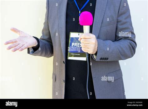 Broadcast journalist gesturing during media interview Stock Photo - Alamy