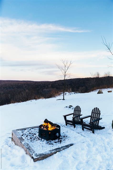 "Winter Fire Pit" by Stocksy Contributor "Raymond Forbes LLC" - Stocksy