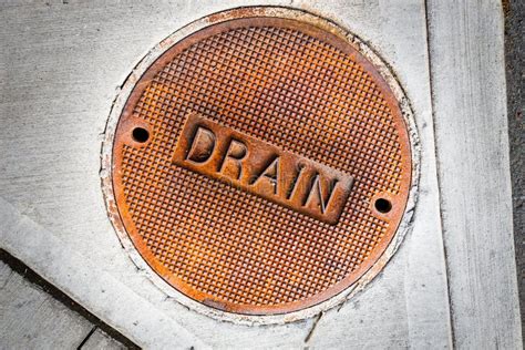 Storm drain cover stock image. Image of sidewalk, hole - 40479673