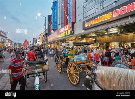 Malioboro Street illuminated at dusk. Yogyakarta, Java, Indonesia Stock Photo - Alamy