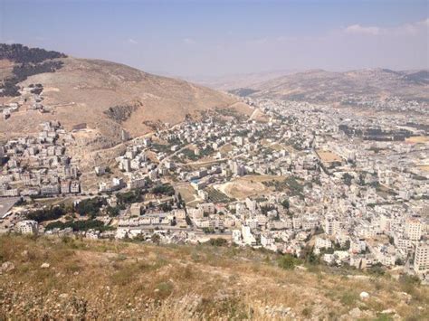 Mount Ebal (across), Shechem (see ruins in the valley between the two mountains), Sychar (top ...