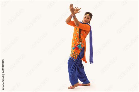 A Giddha dancer performing a dance step with hand gestures. Stock Photo ...