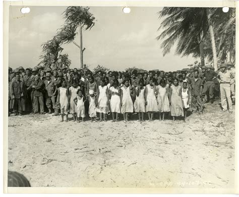 Soldiers stand with young native population from Kwajalein awaiting dedication of United States ...