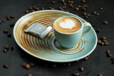 Cup of Coffee with a Heart Shaped Froth Art · Free Stock Photo