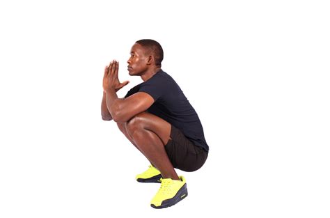 Fitness Man With Flexible Hips Doing Deep Squats