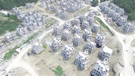 an aerial view of some very large buildings in the middle of a dirt ...