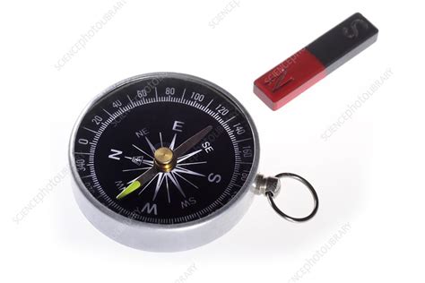 Compass and magnet - Stock Image - C028/8418 - Science Photo Library