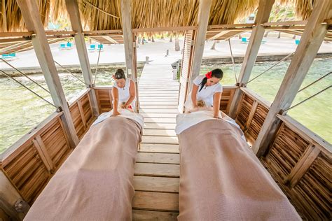 Two people receiving relaxing massages at Victoria House Spa - Victoria House Resort & Spa