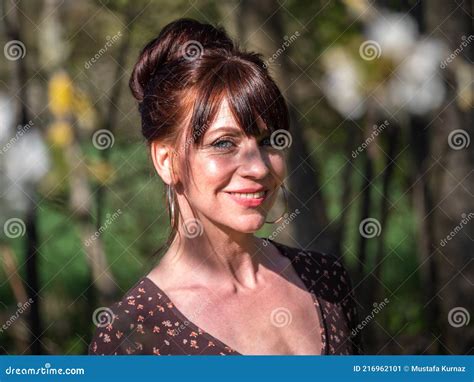 Pretty Woman with Brown Dress Stock Image - Image of leaves, park ...