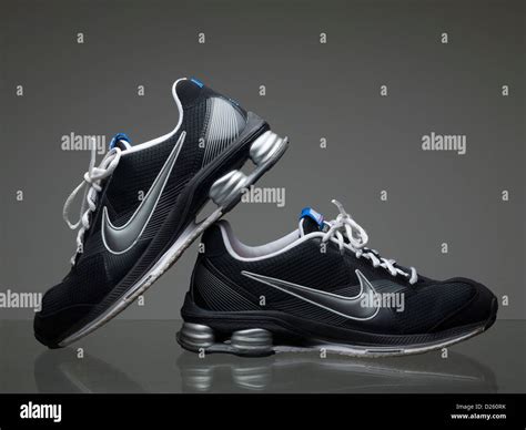 Pair of black Nike running shoes Stock Photo - Alamy