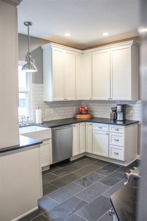 Modern Farmhouse Kitchen. Gray tile floors, white cabinets. Would use a different backsplash ...