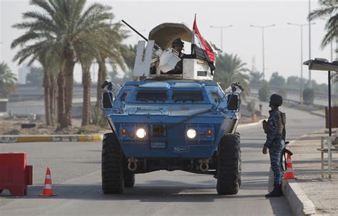 Iraqi police armoured vehicle near Baghdad airport on December 11, 2012 ...