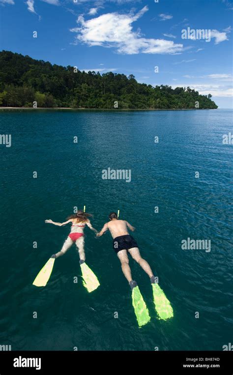 Couple snorkeling on holiday, Gayana Eco-Resort, Gaya Island, Sabah ...