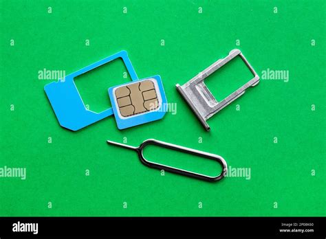 SIM card, tray and ejector on green background, flat lay Stock Photo - Alamy