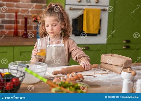 Beautiful Green Kitchen Amazing Cute Little Girl with Curly Hair Preparing the Dough for ...