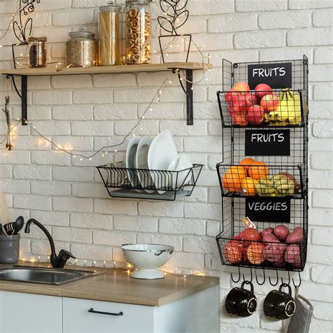 a kitchen with white brick walls and hanging fruit baskets