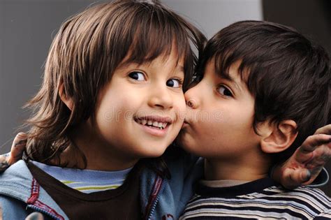 Two brothers, kiss stock photo. Image of studio, preschooler - 19408680