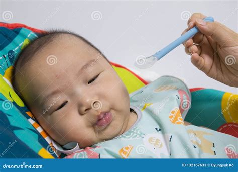 Korean Baby Eating a Baby Food Stock Image - Image of innocent, feeding ...