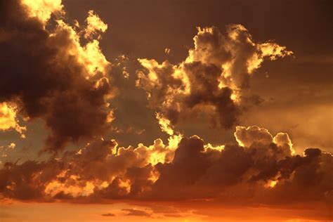 Nimbus Clouds on Clear Blue Sky during Golden Hour · Free Stock Photo