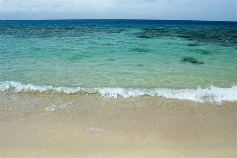 Free Stock photo of Idyllic sandy beach and blue ocean | Photoeverywhere