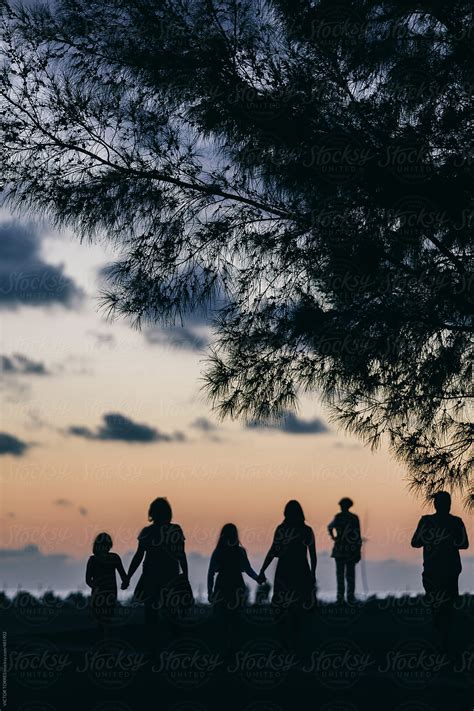 "Silhouettes Of People Walking On The Promenade At Sunset" by Stocksy Contributor "VICTOR TORRES ...