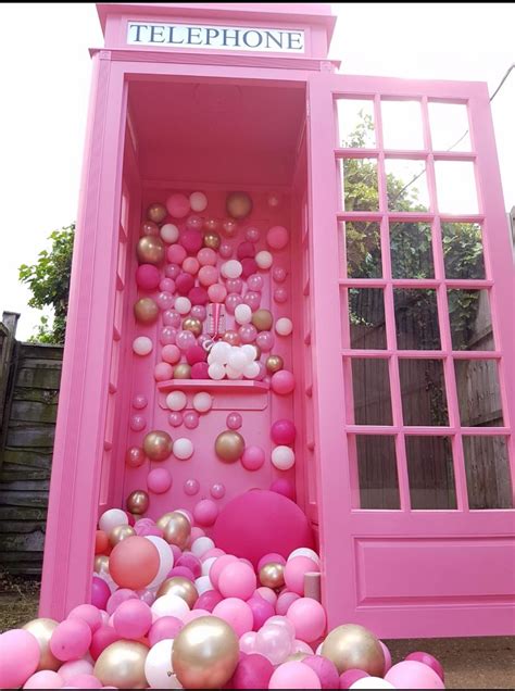 Pink telephone booth which can come personalised with balloons of your own choice and a ...