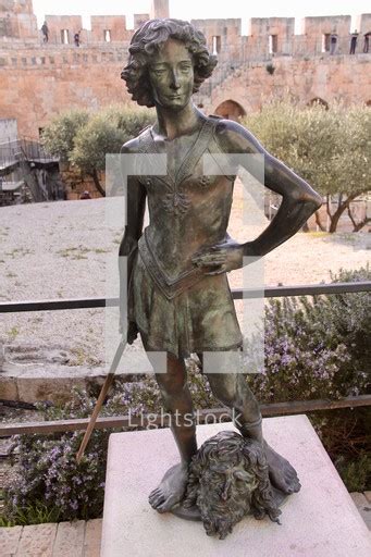 Bronze statue of david standing over goliath's... — Photo — Lightstock