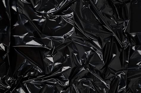 Premium Photo | Full frame abstract background of crumpled black plastic film bag