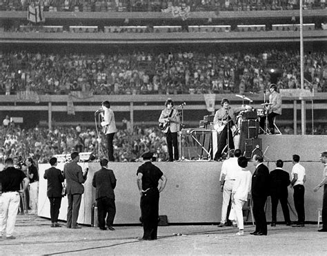 The Beatles take the stage! The iconic rock band is pictured here among ...