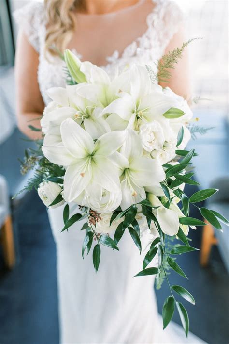 Lily Bouquet | Lily bouquet wedding, Flower bouquet wedding, White rose wedding bouquet