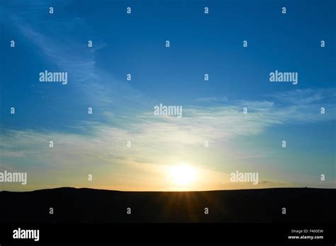 Mountains with colorful blue sky at sunset Stock Photo - Alamy