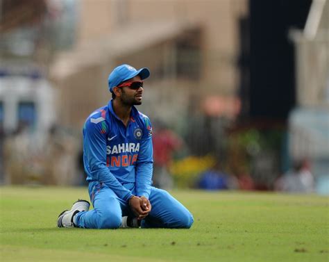 Virat Kohli reacts after grassing a catch | ESPNcricinfo.com