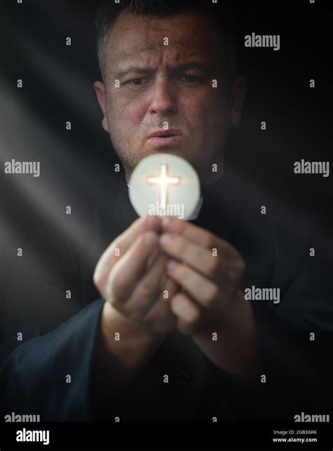 priest prays at the holy mass Stock Photo - Alamy