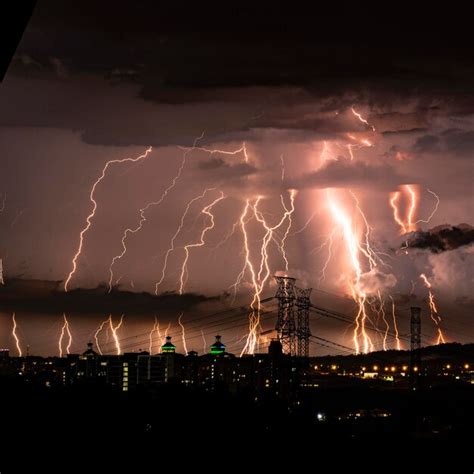 Premium Photo | Lightning in sky over city at night