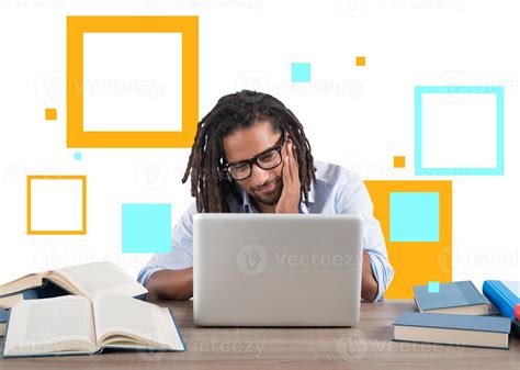 Student studies with his laptop with a desk full of books. Concept on ...