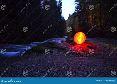 Glowing Red Orb beside Water Stock Image - Image of autumn, glowing ...