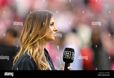 DAZN sports presenter Laura Wontorra, portrait, with microphone, mike, logo, Allianz Arena ...
