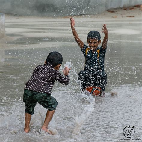 Kids playing in the rain on Behance