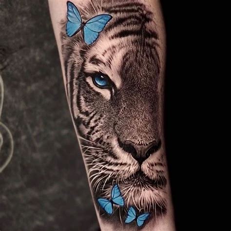 Tiger Tattoo With Blue Butterflies | Tiger tattoo, Tiger tattoo sleeve, Lion head tattoos