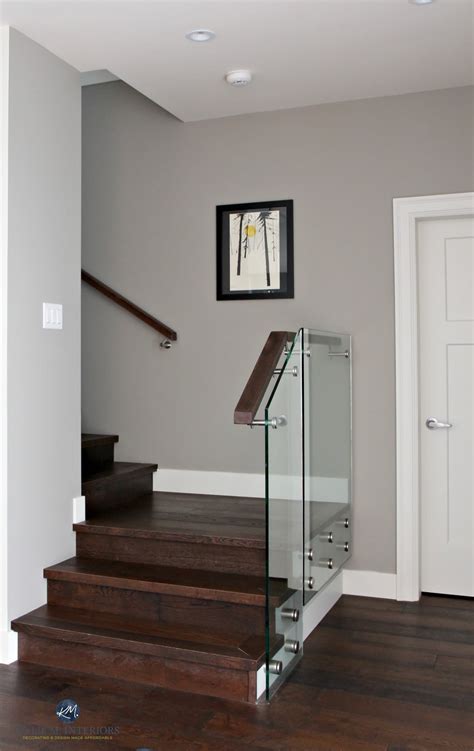 Sherwin Williams Dorian Gray in contemporary stairwell with glass and dark wood. Kylie M ...