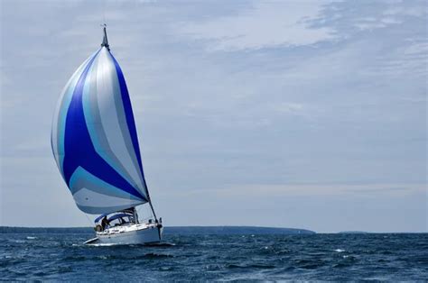 Sailboat with Blue Spinnaker Sail — Stock Photo © herreid #2192382