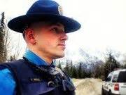 Alaska State Troopers--Trooper Noll stands in wait during his patrol on ...