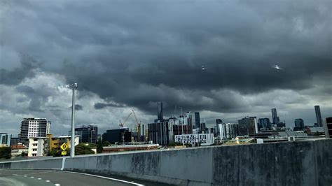 Brisbane storm: Triple front brings hail, flooding, power outages | The Courier Mail