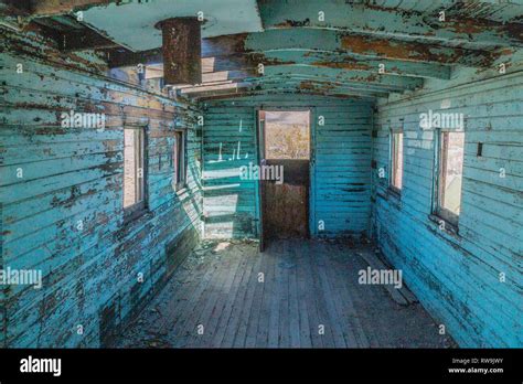 The interior of a neglected Union Pacific caboose train car on a track in Rhyolite, Nevada. It ...