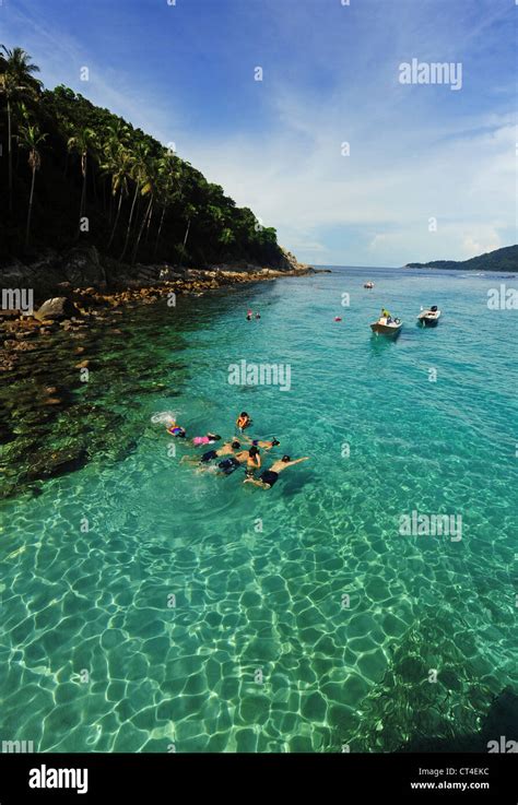 Malaysia, Perhentian Islands, Perhentian Kecil, tourist snorkeling in ...