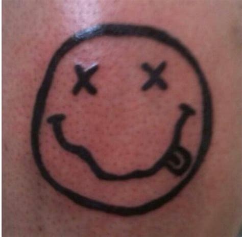 Pin by Caleb Linden on Tattoos and Piercings! | Nirvana smiley tattoo, Smile tattoo, Finger tattoos