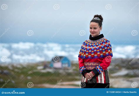 Young Inuit Woman in Traditional Clothing Posing for Photos in a Small ...