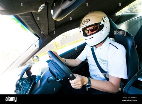 Race Car Driver in an Aston Martin Sports Car Stock Photo - Alamy