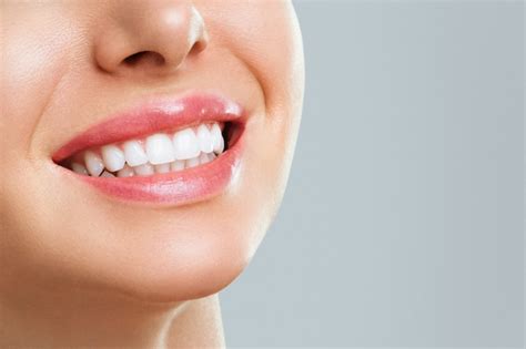 Premium Photo | Perfect healthy teeth smile of a young woman. teeth whitening. stomatology concept.