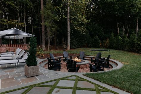 Our Sunken Fire Pit Paired With Black Adirondack Chairs